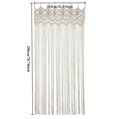 A cream-colored hand-woven DecorBites™ macrame door curtain with a decorative top border and long tassels for home decor