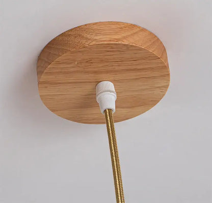 DecorBites™ handcrafted bamboo pendant lamp with a round natural oak wood ceiling plate and brass braided cord