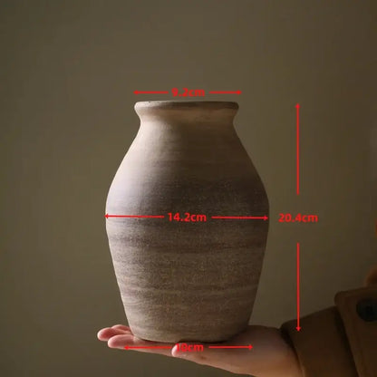 DecorBites™ handmade ceramic vase in rustic earth tones with textured surface and horizontal ridges for home decoration