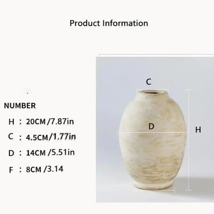 Cream-colored handmade ceramic vase with textured uneven surface and rounded body for vintage style home decor