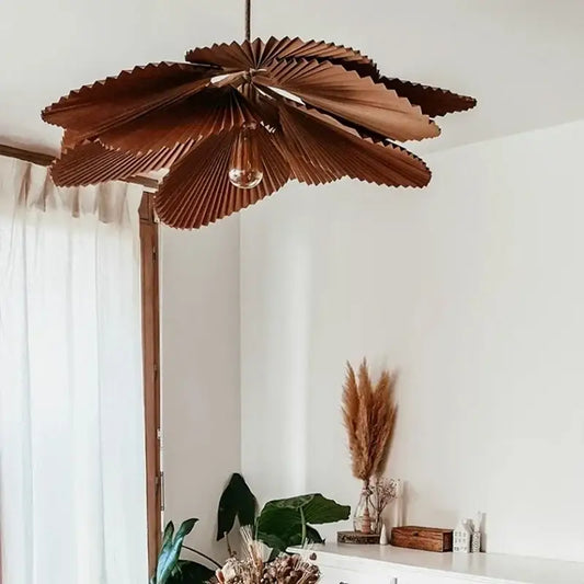A decorbites handmade floral chandelier in brown wood with petal-shaped rustic pendant design for dining rooms