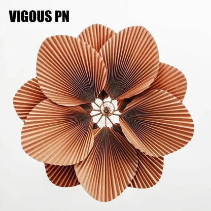 Decorbites handmade floral chandelier featuring copper-colored pleated paper flower with central metallic accent for dining room lighting
