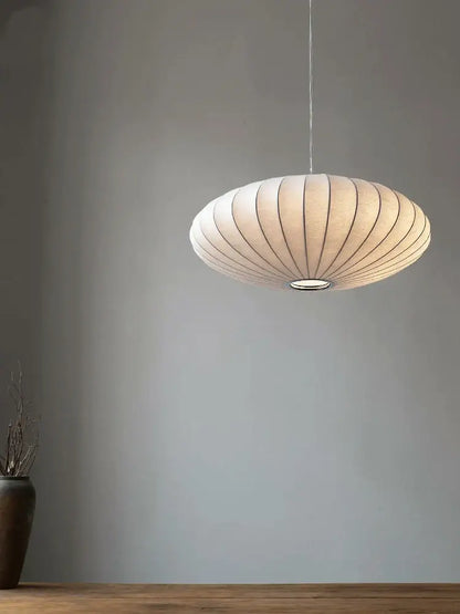 Cream-colored ribbed paper pendant light with metallic ring base in japanese style silk chandelier by decorbites