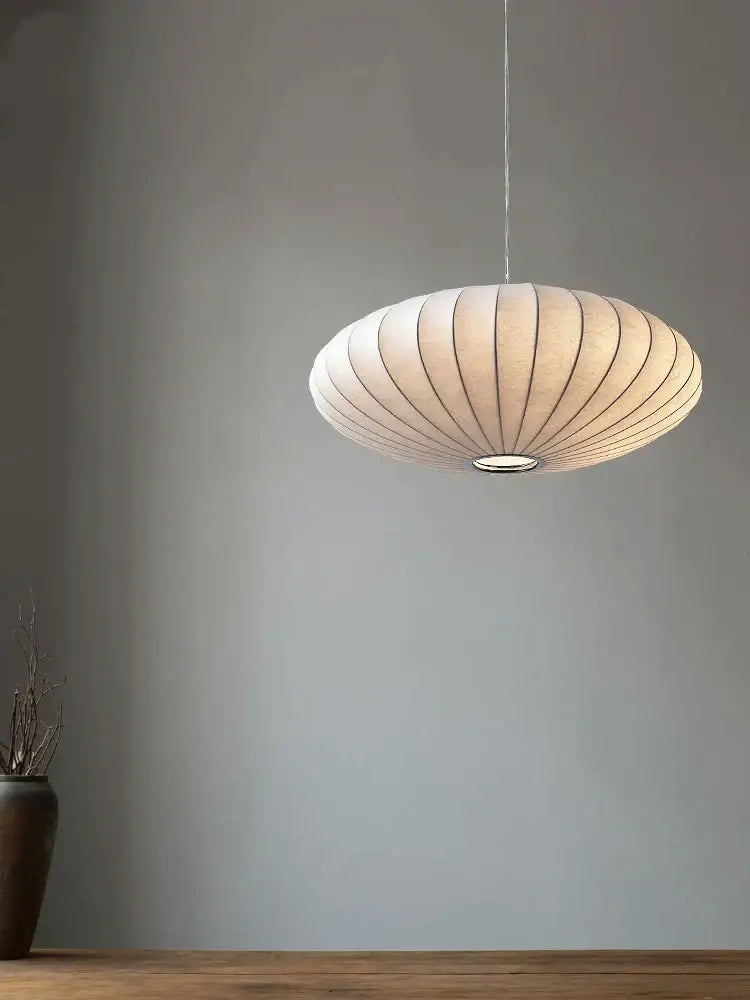 Cream-colored ribbed paper pendant light with metallic ring base in japanese style silk chandelier by decorbites