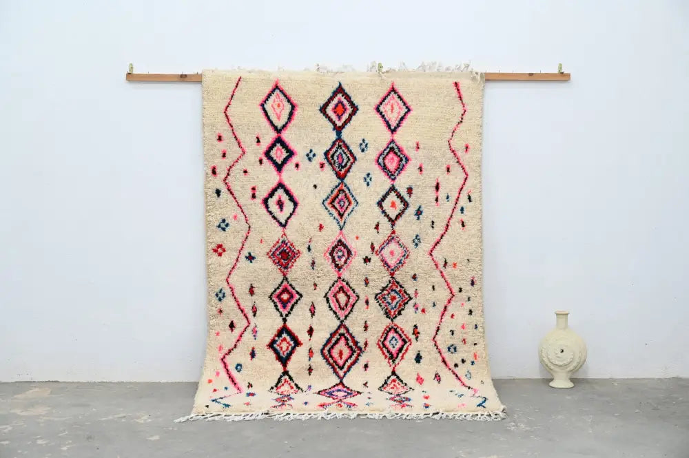 Beige handmade traditional azilal rug with pink red and navy blue geometric diamond and zigzag patterns 230x154cm