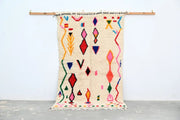 Beige moroccan handmade azilal rug with vibrant geometric patterns in natural wool by DecorBites 231x131cm