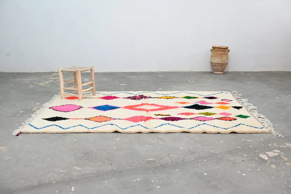 Beige cream handmade moroccan azilal rug with vibrant colors geometric patterns in pink blue orange and green 237x155 cm