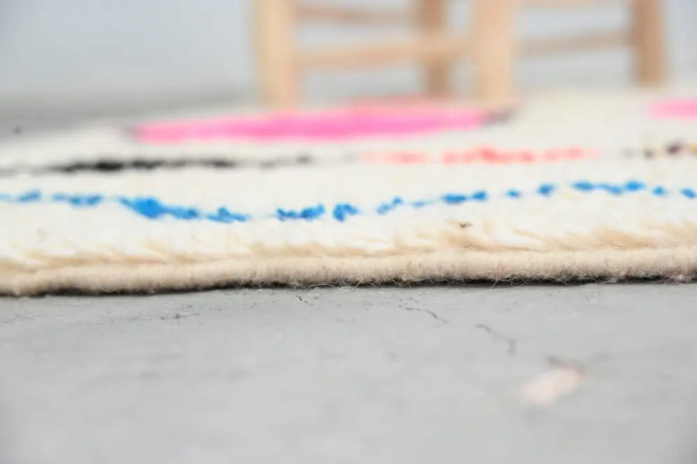 DecorBites™ handmade Moroccan Azilal rug cream-colored wool with vibrant pink and blue bold horizontal stripes 237x155 cm