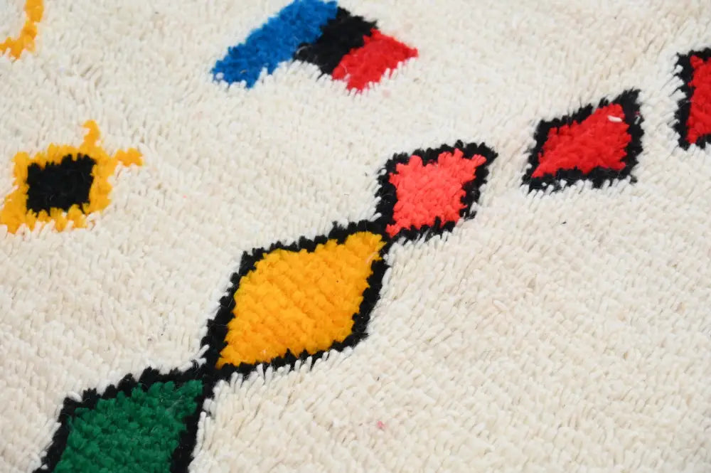 DecorBites™ handmade traditional azilal rug 242x140cm with a plush white base and vibrant multicolor geometric diamond pattern