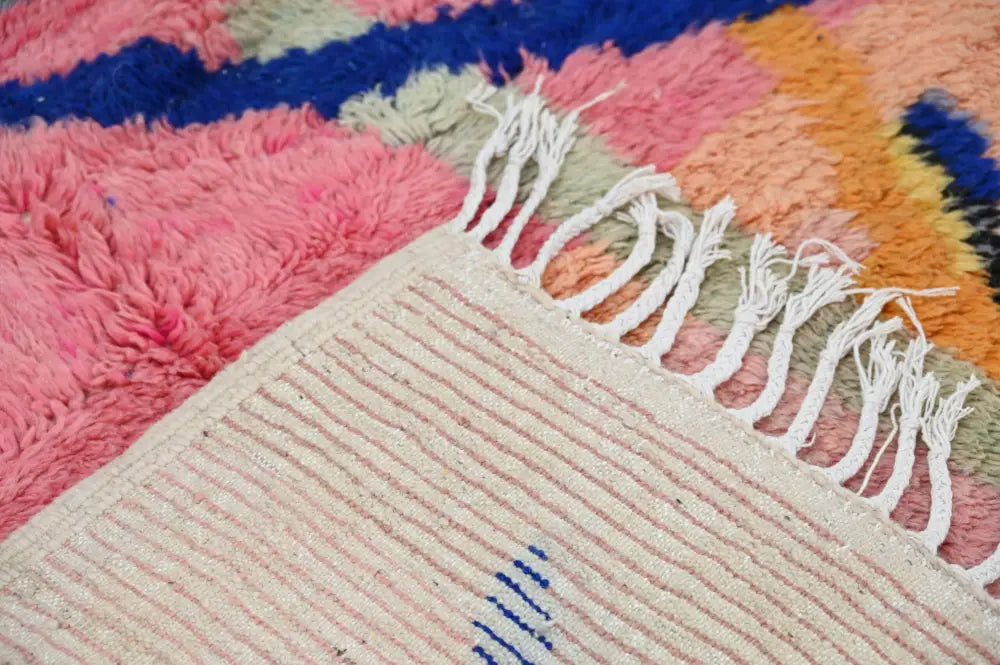 DecorBites™ handmade Moroccan Azilal rug 244x147 cm with vibrant pink blue orange sections and cream striped border with fringe