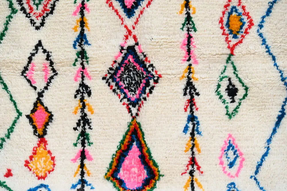 Decorbites handmade moroccan azilal rug 246x148 cm with vibrant geometric patterns in natural wool