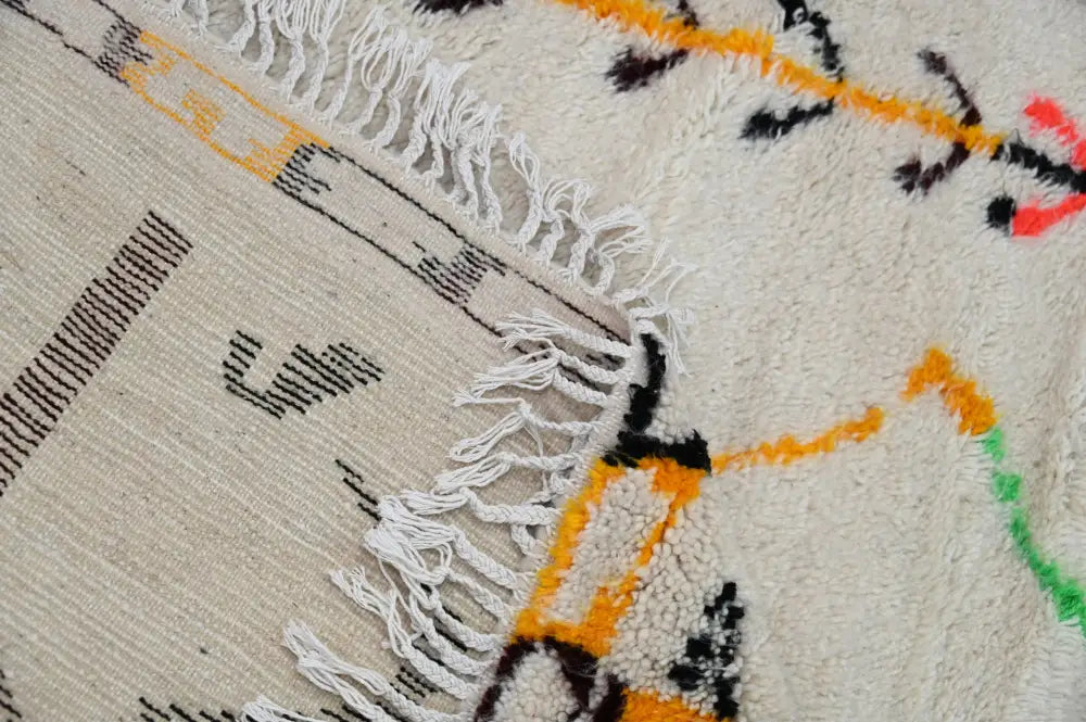 Beige DecorBites™ handmade moroccan azilal rug with bold black orange green red geometric patterns and fringed edges 248x151 cm
