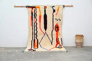 Beige decorbites™ handmade traditional azilal rug with bold orange black and blue vertical patterns 250x145 cm