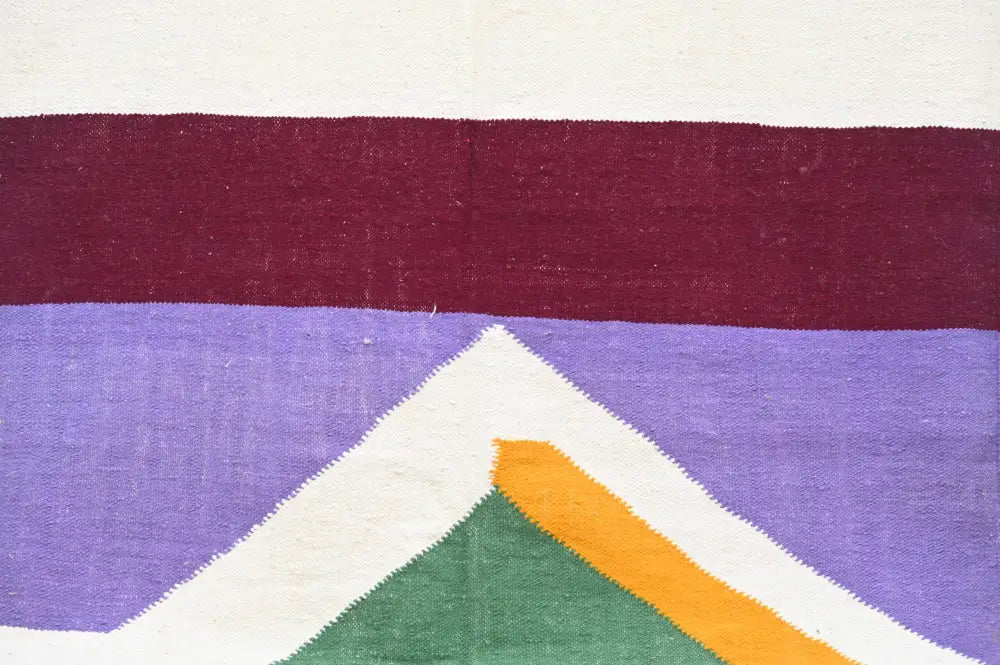 DecorBites™ handmade moroccan azilal rug with geometric maroon purple white bands and central green orange triangle design
