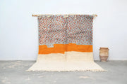 Handwoven decorbites™ handmade moroccan azilal rug with textured gray and orange stripes on off-white base 304 x 210 cm