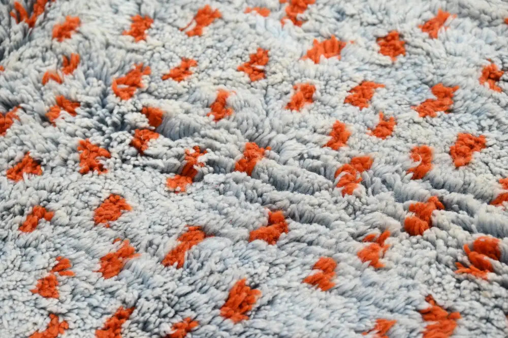DecorBites™ handmade Moroccan azilal rug with soft gray and orange patterns and a textured plush surface 304 x 210 cm