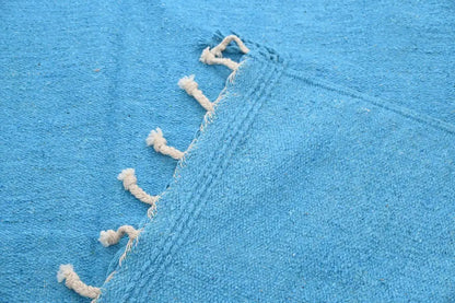 Bright blue woven decorbites™ handmade moroccan azilal rug 306x200cm with cream-colored tassels along the edge