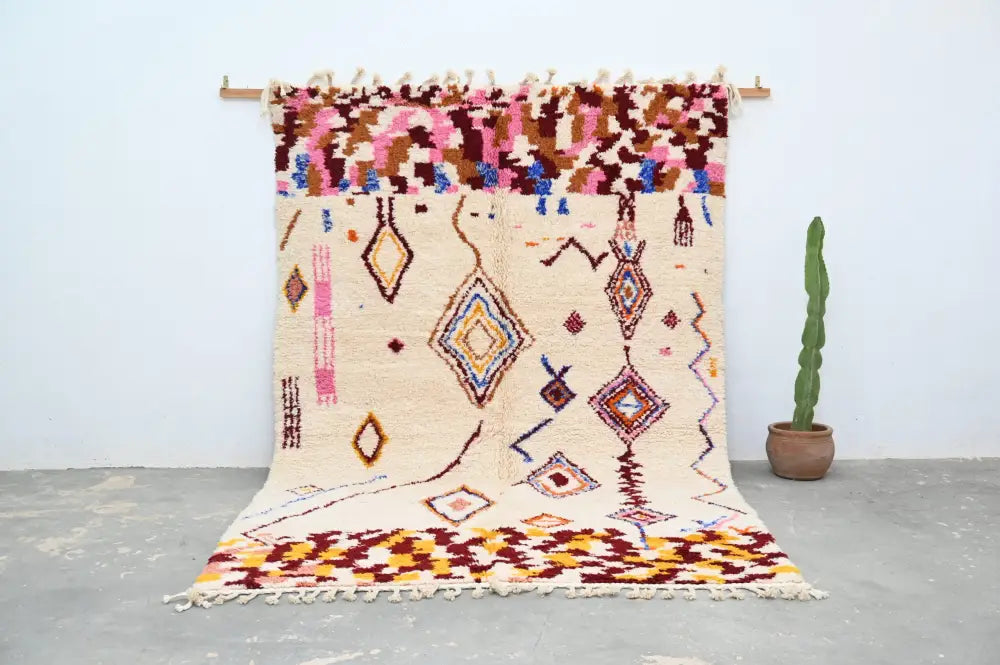 Beige moroccan azilal rug handmade by decorbites with colorful geometric patterns and fringed edges 309x207cm