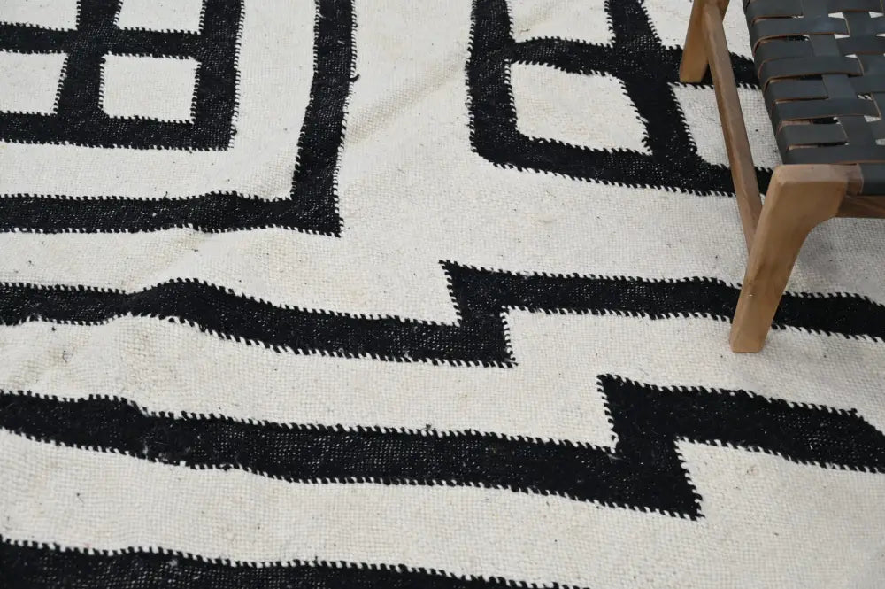 Decorbites™ handmade moroccan azilal rug featuring black and white geometric patterns with a textured woven design