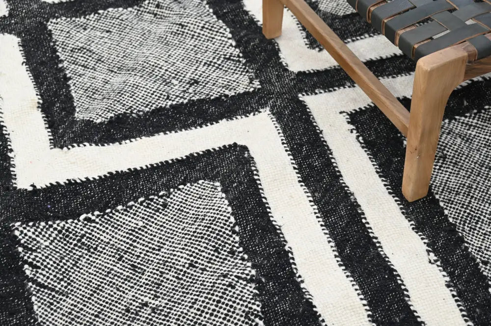 DecorBites™ handmade traditional azilal rug with black and white geometric pattern and textured woven design