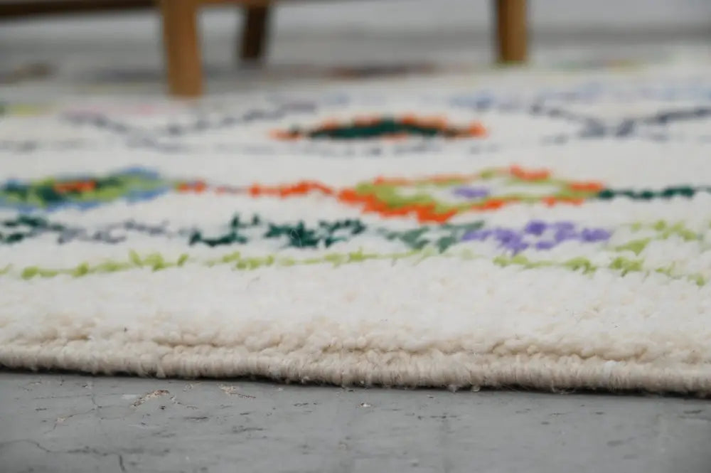 DecorBites™ handmade traditional azilal rug 315x194cm with colorful floral wool patterns on a cream base