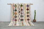Beige handmade decorbites™ traditional azilal rug with colorful geometric patterns and fringed edges 315x194cm