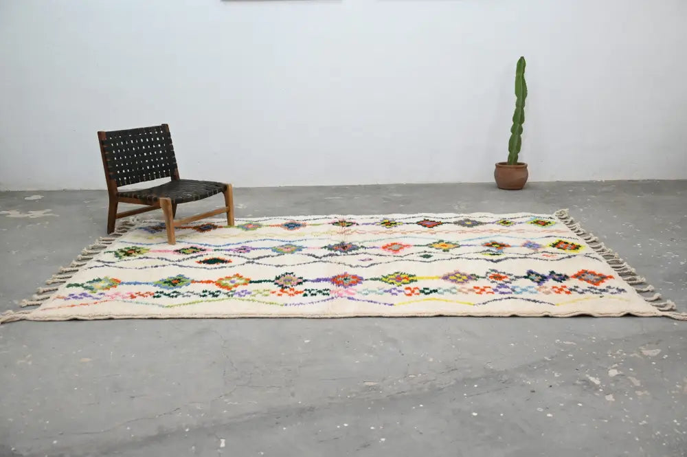 Beige DecorBites™ handmade traditional Azilal rug with colorful geometric patterns and fringed edges, 315x194cm