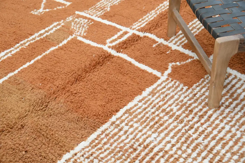 A plush terracotta orange decorbites™ handmade traditional azilal rug with white geometric woven lines 328x197cm