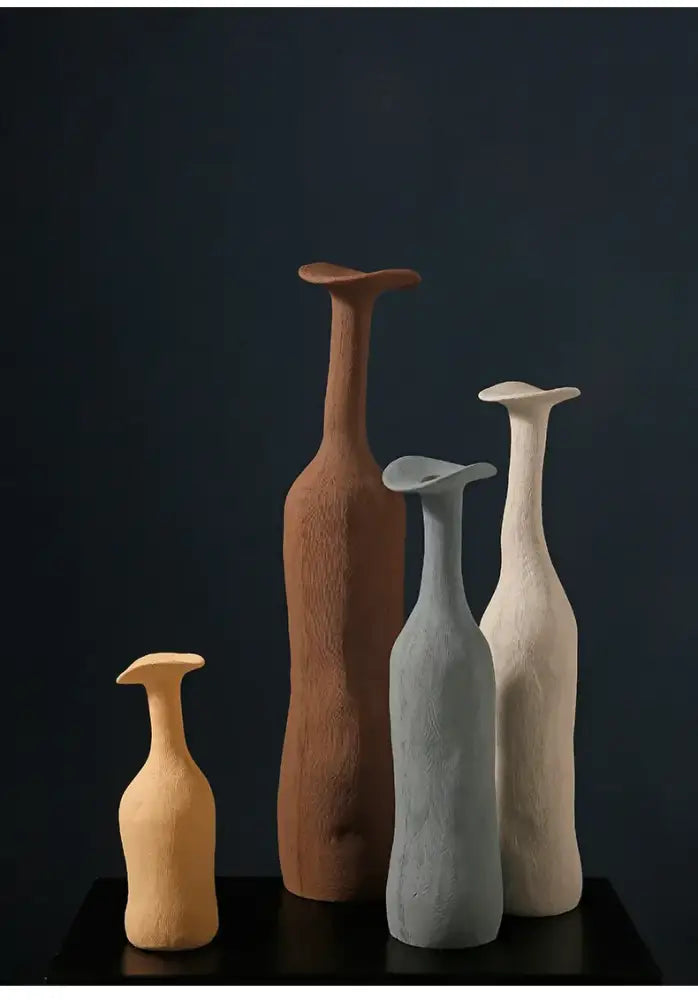 Set of four DecorBites handmade nordic ceramic flower vases with earthy tones textured surfaces and flared tops