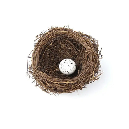 DecorBites™ handmade round rattan bird nest decoration with a white speckled egg nestled inside a woven brown bird nest