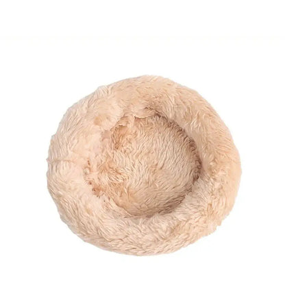 Beige plush circular pet bed with soft fluffy texture inside decorbites handwoven grass bird cage for small birds