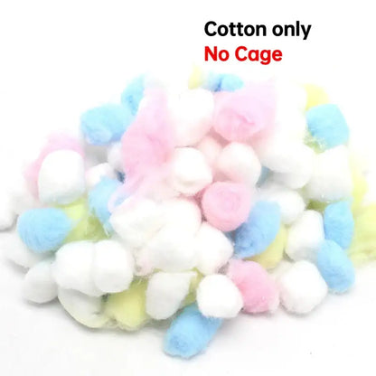 A pile of pastel pink blue white and yellow soft cotton balls beside decorbites handwoven grass bird cage hut