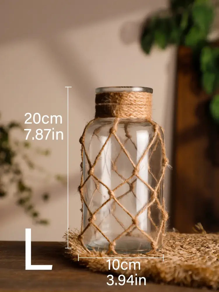 Clear glass hanging vase with woven natural twine lattice and hemp rope band for rustic home decor by DecorBites
