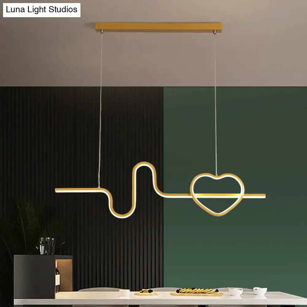 Gold-colored metal heart and line island pendant light fixture designed for modern dining room decor by DecorBites™