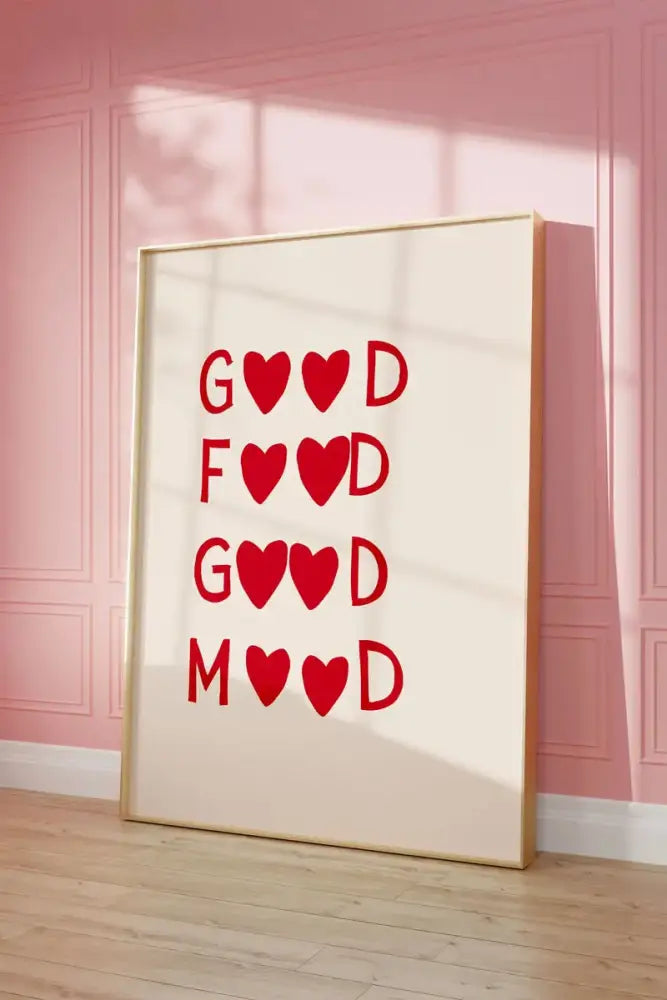 A framed wall art painting by decorbites featuring a cream background with bold red heart red quote good food good mood