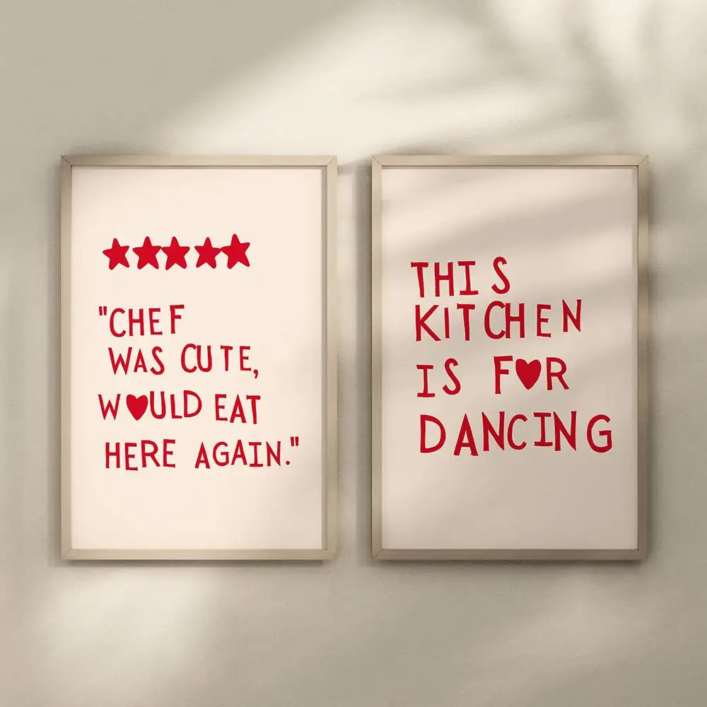 Two framed DecorBites heart red quote wall art prints with red text on off-white backgrounds in wooden frames
