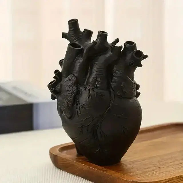 Black anatomically detailed heart shape resin vase with textured surface and visible vessel openings by DecorBites™