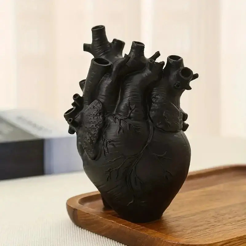 Black DecorBites™ heart shape resin vase with multiple openings and textured surface in anatomically detailed design