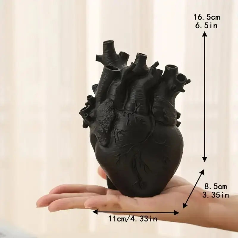 Black anatomically detailed heart shape resin vase made of matte ceramic with realistic vein texture by DecorBites