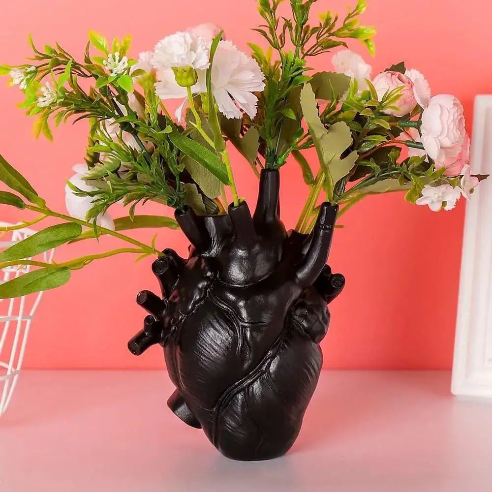 DecorBites™ heart shape resin vase in black holding artificial white and pink flowers for elegant decor