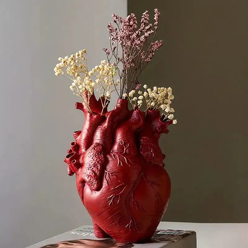Red heart shape resin vase by DecorBites™ with detailed texture holding dried flowers in a unique shape resin design