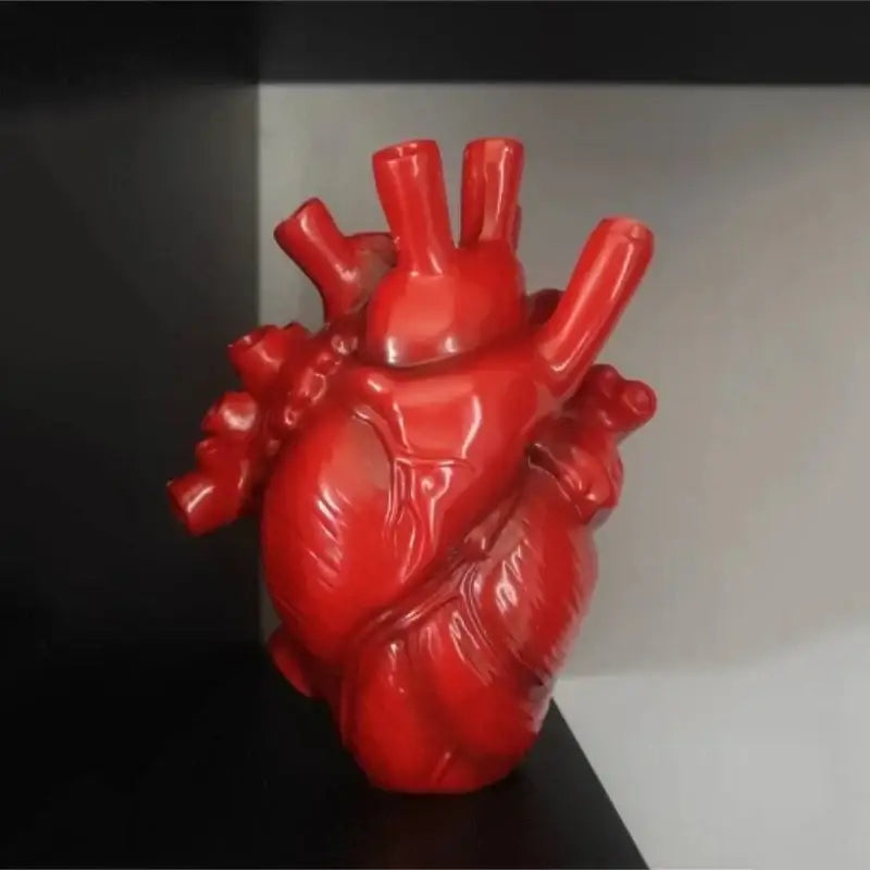 Vibrant red glossy heart shape resin vase from decorbites featuring anatomical shape resin design in four colors