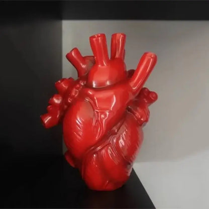 Vibrant red glossy resin vase in anatomical heart shape from decorbites™ collection featuring shape resin design