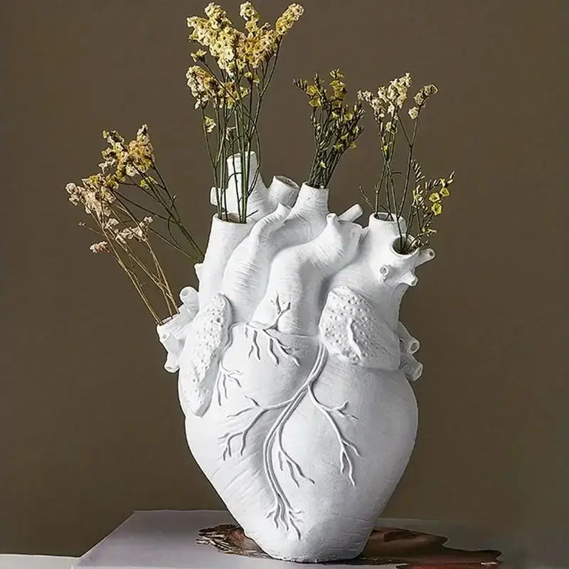 White ceramic resin vase shaped like a human heart with detailed anatomical features from decorbites shape resin vase collection