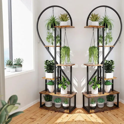 Rustic wooden and black metal heart shape plant stand with hooks for 20 pots holding various potted plants
