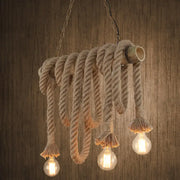 Decorbites hemp rope pendant light with rustic beige rope, exposed edison bulbs, and bamboo tube fixture in flaxen