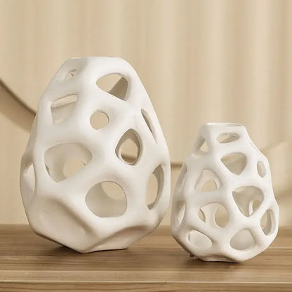 White ceramic vase with porous organic lattice design showcasing nordic classical style by DecorBites™