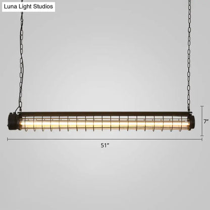 Industrial black cage island pendant with tubular cage design, black metal frame, and warm glow for dining room lighting