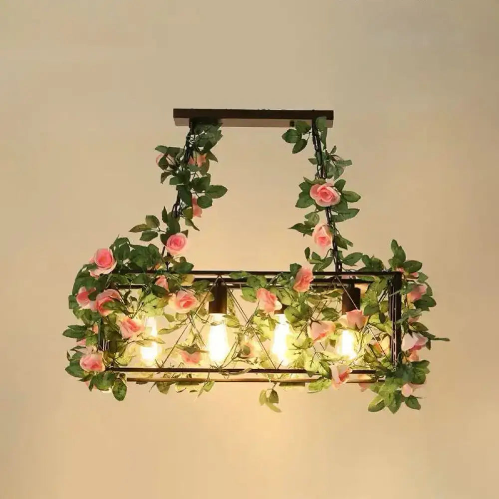 Decorbites™ industrial cage island pendant light with dark metal frame and plant decoration of pink roses and green vines