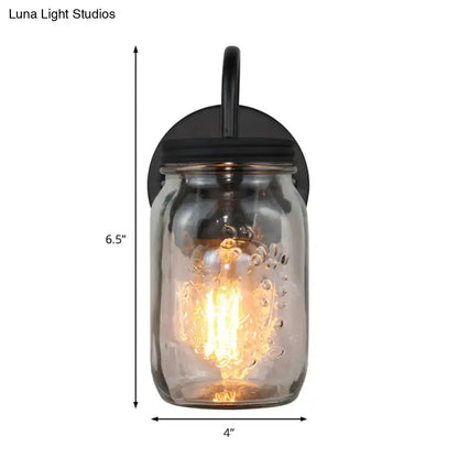 Industrial black jar shade wall lamp featuring clear glass mason jar with textured bubbles and exposed filament bulb